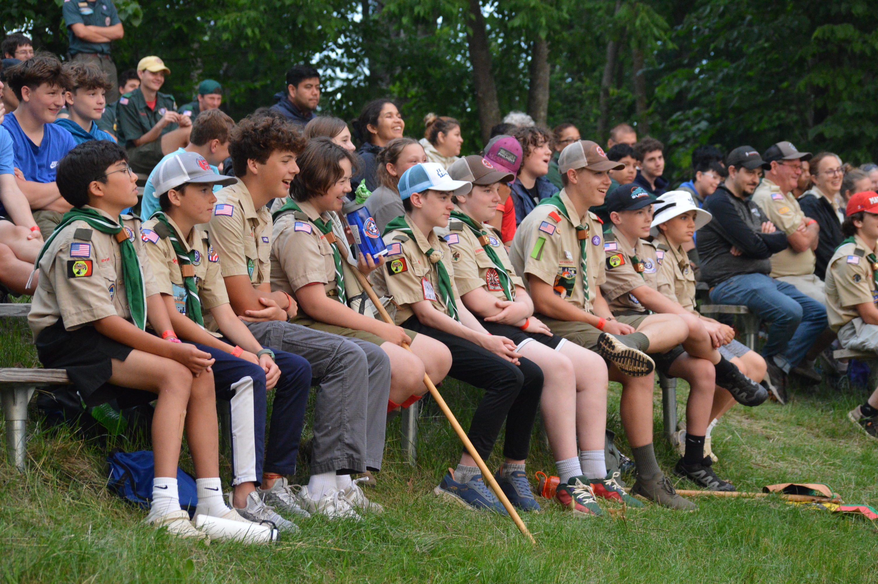 Scouts seated and watching the campfire ceremony.