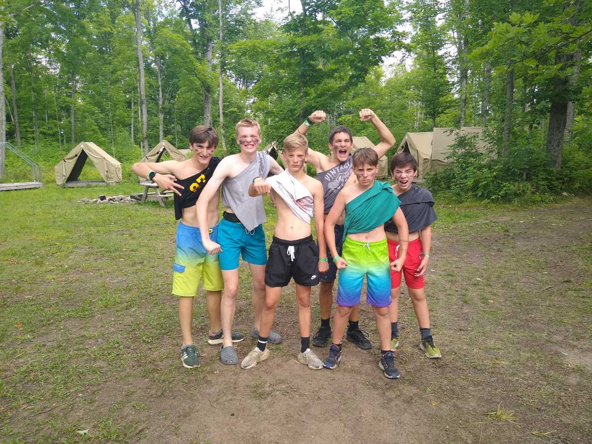 A bunch of scouts flex playfully for the camera